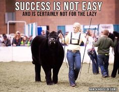 a woman leading a cow with a quote on it