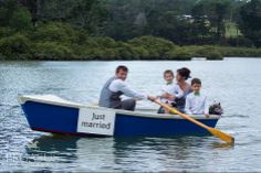 a man and two children in a blue boat