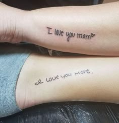 two people with tattoos that say i love you more