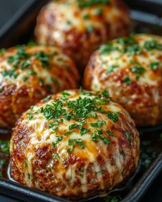 baked meatballs with cheese and parsley in a baking pan, ready to be eaten