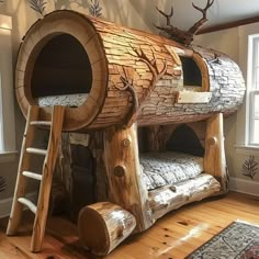 a wooden bunk bed made out of logs with a slide down the side and ladder up to it