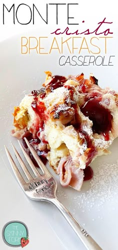 a white plate topped with bread and jelly covered pastry next to a fork on top of it