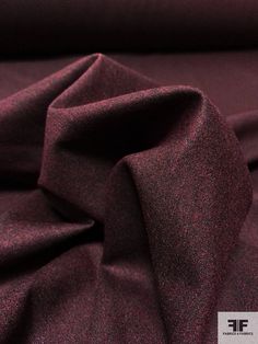 the fabric is very dark purple and has a slight pattern on it