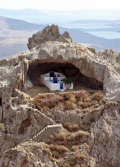 a small house built into the side of a mountain