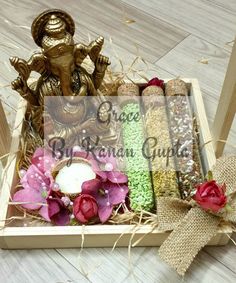 a wooden box filled with candy and flowers