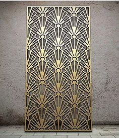 an art deco design is shown on the side of a concrete wall in this photo