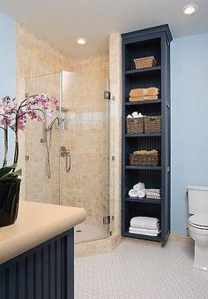 a bathroom with blue walls and white flooring