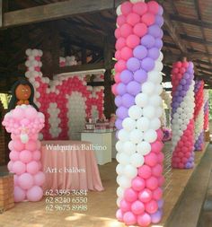 balloons are arranged in the shape of letters and figures for a party or celebration at an outdoor venue