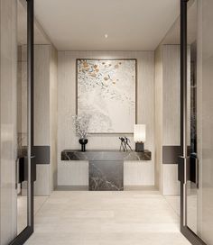 an elegant bathroom with marble counter tops and white tile flooring, along with large paintings on the walls