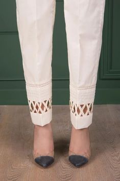 Beautiful pure cream cotton designer hand made lader trouser pant Full stitched product 🌺pair this trouser pant with crop top or tunic/shirt These loose fitting pant design is in trend right now 🌺This creates classic and elegant look that is easy to wear and will get noticed for sure 🌺Front belt Back elastic Flexible sizes Quality stitching NOTE: There might be slightly colour variation due to light and resolution and different colour settings. 🌺Please send me a message if you have any quest Festive Fitted Casual Pants, Elegant Chikankari Embroidered Pants For Summer, Off White Cotton Straight Pants, Elegant Summer Pants With Chikankari Embroidery, Cotton Straight Pant Set For Summer, Fitted White Cotton Pant Set, Spring Cotton Trouser Sets, Beige Summer Sets With Straight Pants, Spring Cotton Sets With Trousers