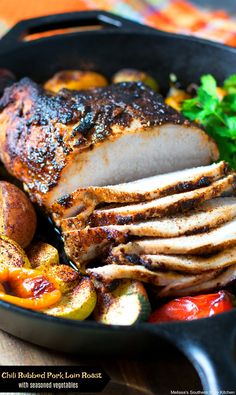 a roasting pan filled with sliced meat and vegetables