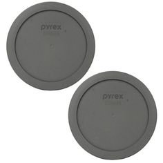 two gray plates sitting next to each other on a white surface with the words pyrx printed on them