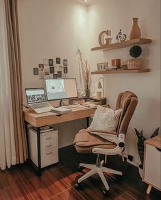 a home office with two laptops on the desk