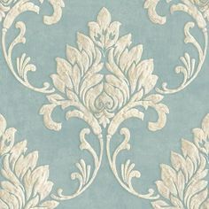 a blue and white wallpaper with an ornate design