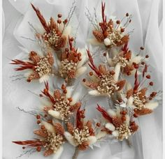 some white and red flowers on a white cloth