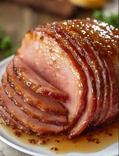 sliced ham sitting on top of a white plate