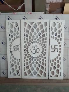 decorative laser cut screens with an om symbol on them