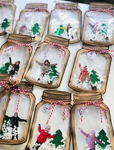 mason jars filled with miniature christmas ornaments on top of a table