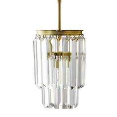 a brass and crystal chandelier hanging from a ceiling fixture on a white background