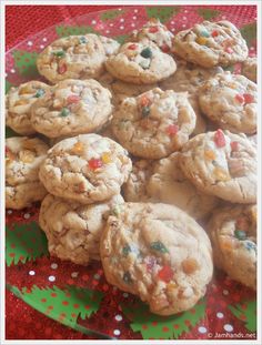 a plate full of cookies with sprinkles on it sitting on a table