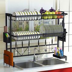 the dish rack is holding many dishes in it's placemats and utensils