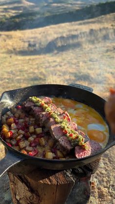 someone is cooking food on an outdoor grill