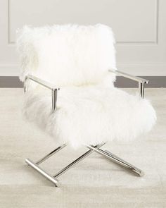 a white chair sitting on top of a carpet covered floor