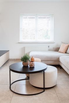 a living room with two couches and a coffee table