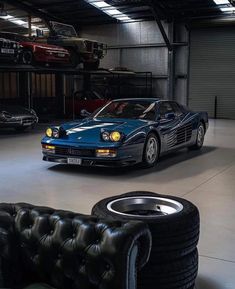 two cars parked in a garage next to each other