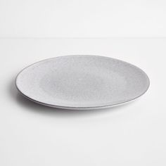 a white plate sitting on top of a table