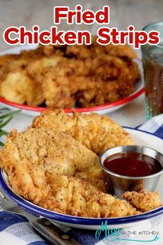 fried chicken strips on a plate with dipping sauce