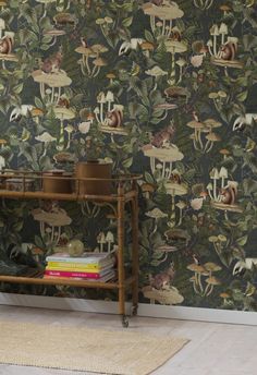 the wallpaper is very colorful and has many animals on it, as well as plants