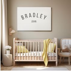 a baby's room with a crib, rocking chair and large poster on the wall