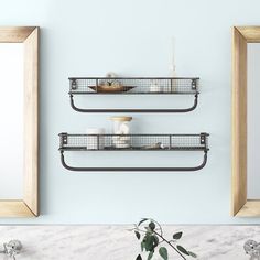 two metal shelves with baskets on them in a bathroom next to a mirror and sink