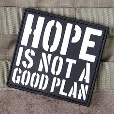 a black and white patch with the words hope is not a good plan on it