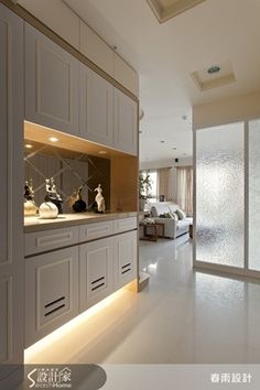 the interior of a house with white walls and cabinets