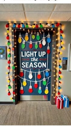 an office door decorated with christmas lights and presents for the holiday season is shown in this photo