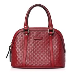 This is an authentic GUCCI Soft Microguccissima Mini Dome Bag in Rosso. This chic handbag is crafted of Gucci GG embossed calfskin leather in red. The bag features rolled leather top handles and a removable, adjustable shoulder strap with light gold hardware. The wrap-around zipper opens to a spacious beige fabric interior with a patch pocket. Chic Handbags, Leather Top, Gold Hardware, Patch Pocket, Calf Skin, Shoulder Strap, Gucci, Handbags, Red