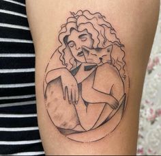 a woman with a cat tattoo on her thigh, sitting in a circle and hugging