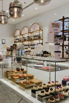 a pastry shop filled with lots of cakes and pastries