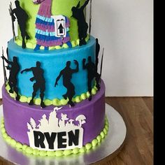 a three tiered cake decorated with silhouettes of people on the top and bottom