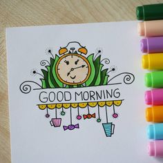 a coloring book with colored markers and crayons next to it that says good morning