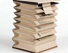 there is a stack of papers that are stacked on top of each other in the shape of a pyramid