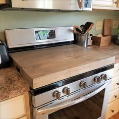 a kitchen with an oven, stove and counter top