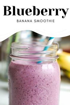 blueberry banana smoothie in a mason jar with a straw on the top and text overlay