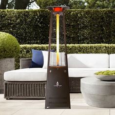 This standing patio heater features upgraded hardware, finishes, and new eco-friendly heating options. It is engineered with upgraded solid steel, aluminum, and 304-grade stainless steel. The signature column of flame heater distributes a massive 56, 000 BTUs that covers approximately 36 square feet. The flame is protected from extreme temperatures and weather by a 4 ft. borosilicate glass tube. It has exclusive chrome reflectors that visually augments the flame for optimal viewing. Touch-to-sta Natural Gas Patio Heater, Gas Patio Heater, Propane Patio Heater, Gas Heater, Outdoor Heaters, Door Upgrade, Propane Tank, Outdoor Heating, Patio Heater