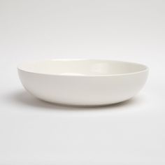 a white bowl sitting on top of a table