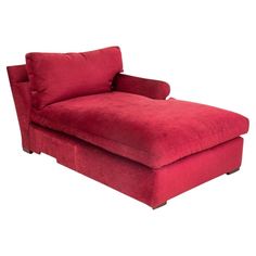 a red chaise lounge chair sitting on top of a white floor