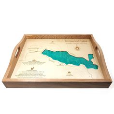 a wooden tray with a lake map on it