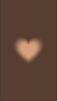 a heart shaped shadow on a brown background